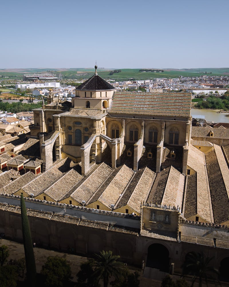 Huge Christian cathedral bursting through the roof of the Islamic Prayer hall of the Mosque/Cathedral Córdoba