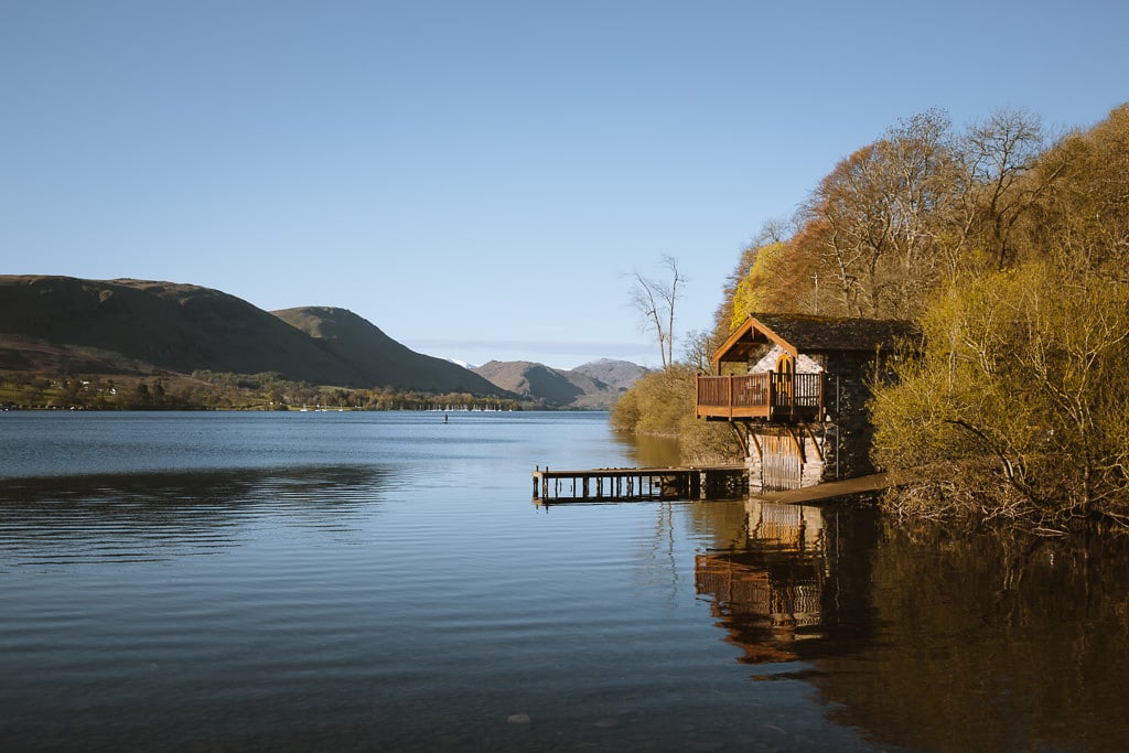 Small hut on a bright blue lake in the Lake District, Ullswater.