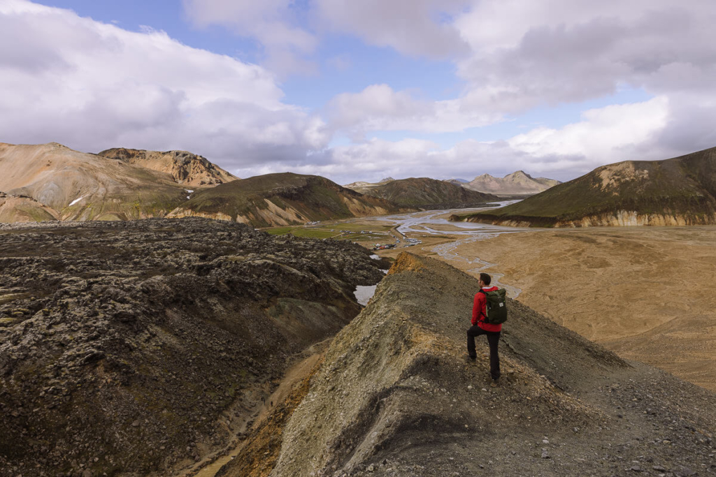 hiker standing on a ridge in Landmannalaugar