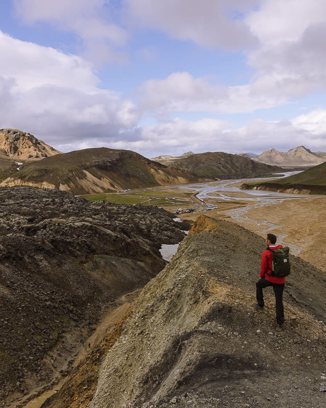 hiker standing on a ridge in Landmannalaugar