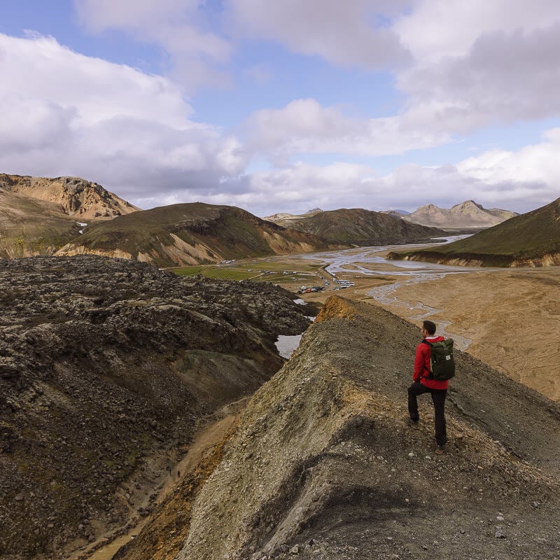 hiker standing on a ridge in Landmannalaugar