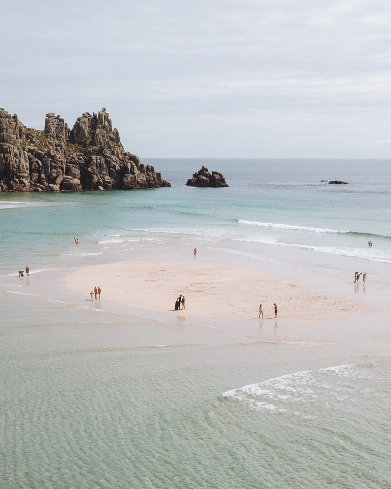 large beach with a sandbar and lagoon pool