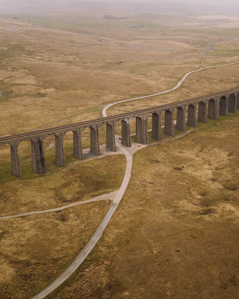 Large viaduct with arches curves along a valley