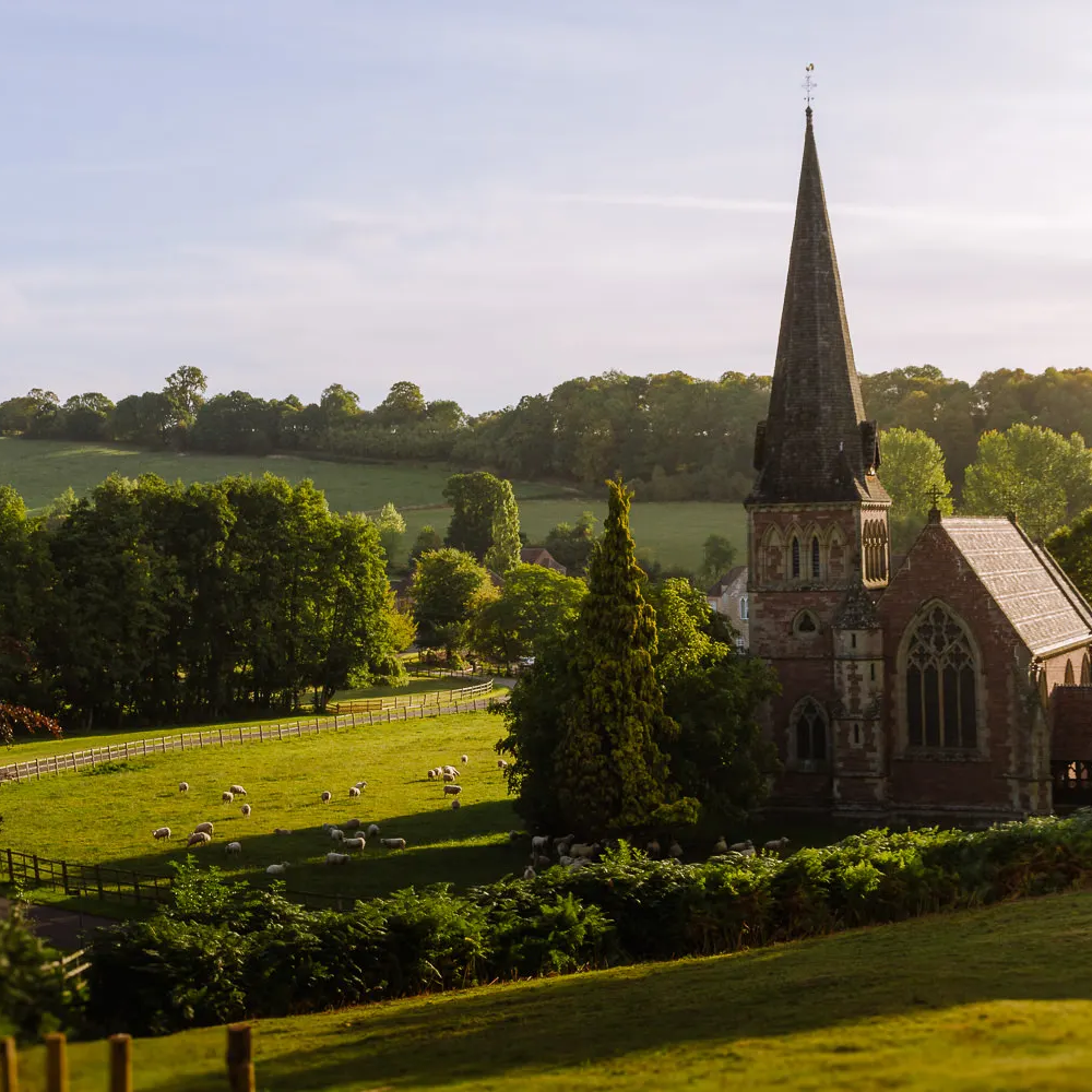 country church in cotswolds rolling green fiels