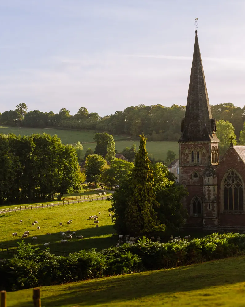country church in cotswolds rolling green fiels