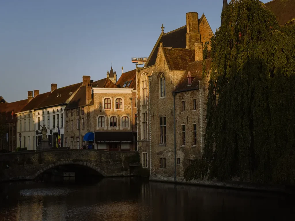 dawn light over rozenhoedkaai bruges belgium