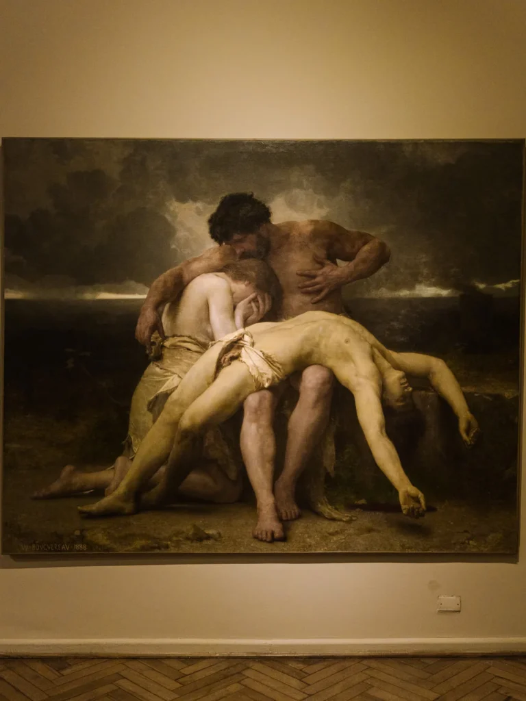 "The First Mourning" by William-Adolphe Bouguereau (1888) on display at the Museo Nacional de Bellas Artes in Buenos Aires, depicting two figures mourning over a limp body against a stormy sky