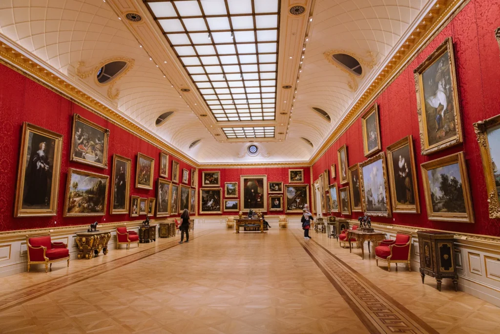 Grand hall hung with paintings in the Wallace Collection in Marylebone.