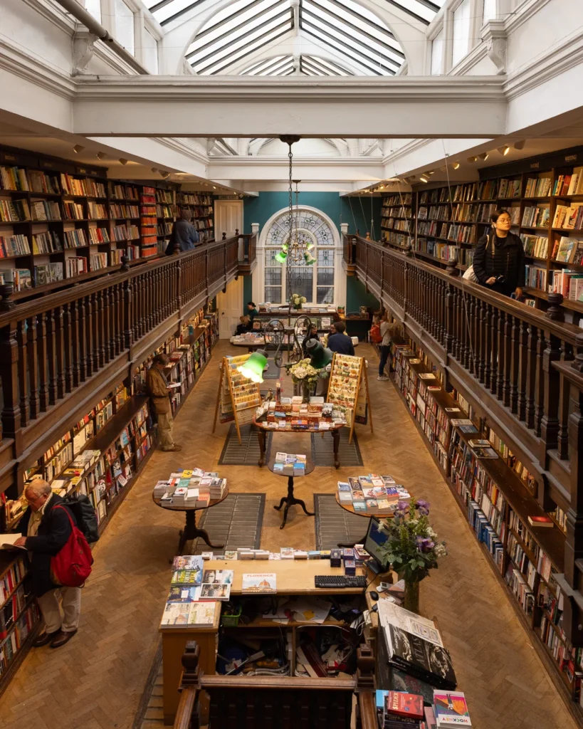 Interior of Daunt Books with two floors of books.