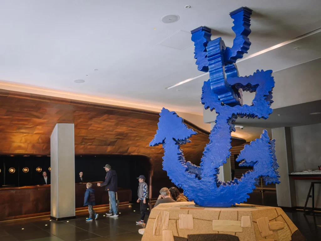 A large blue anchor on a wooden plinth in the reception of the Sea Containers Hotel.