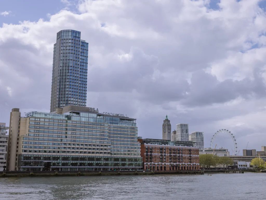 The Sea Containers Hotel perched above the River Thames with the London Eye in the background.