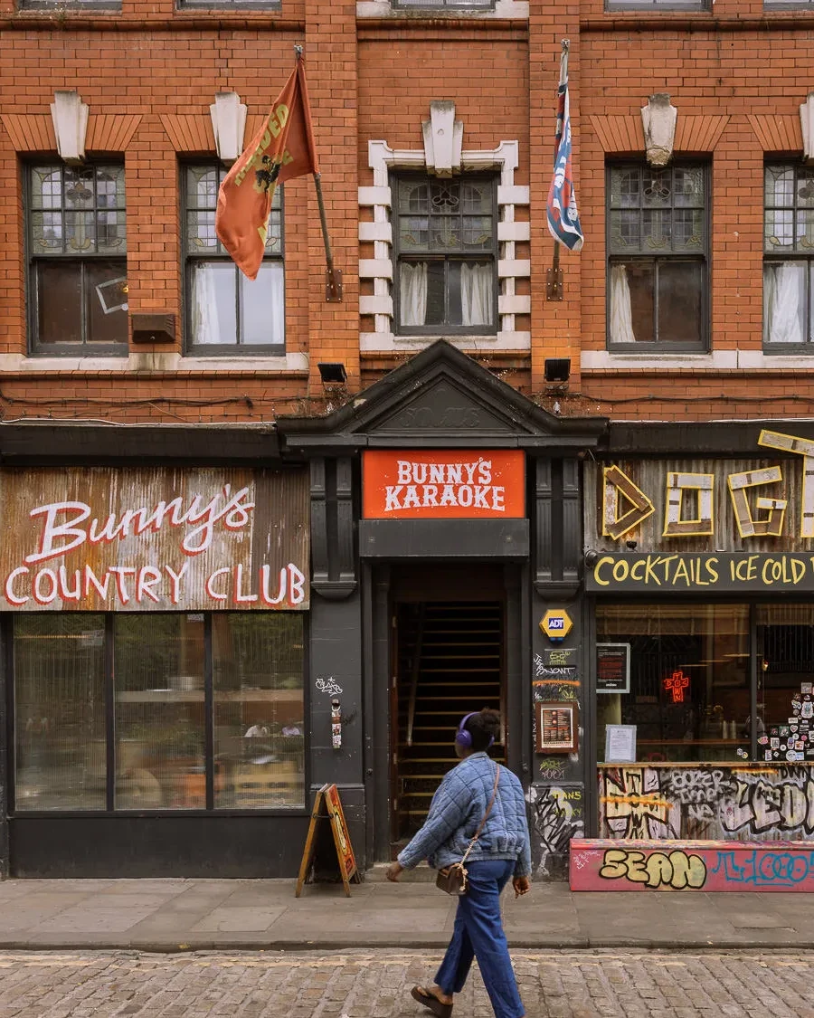 Front of Bunny’s Country Club and Dogtown in Manchester’s Northern Quarter, with colourful signage and a cobbled street in the foreground.
