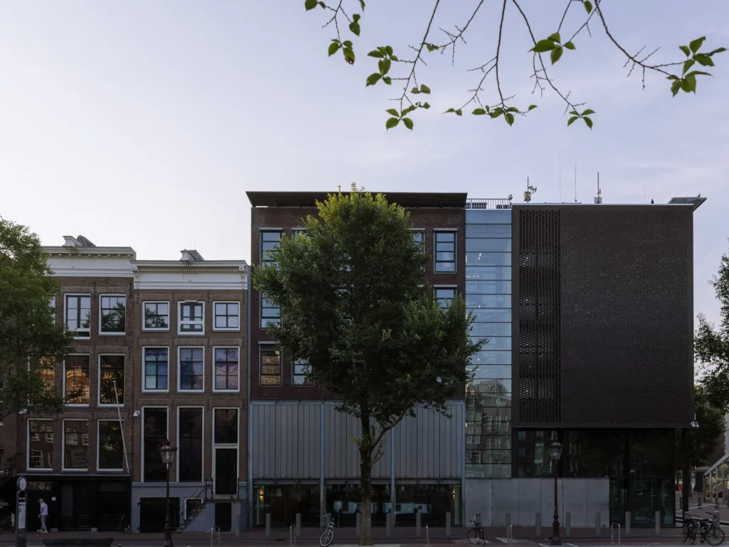 Modern Anne Frank House museum building beside historic canal houses on Prinsengracht in Amsterdam