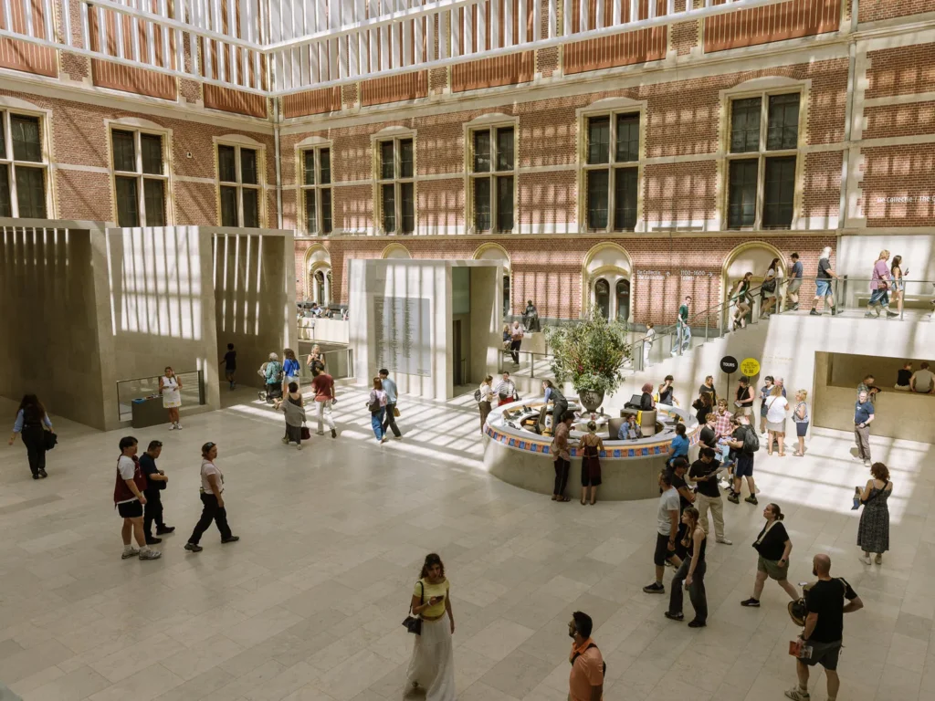 Visitors in the light-filled atrium of the Rijksmuseum in Amsterdam